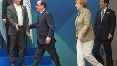 Francois Hollande, Angela Merkel y Shinzo Abe a su arribo en la reunión del G20.