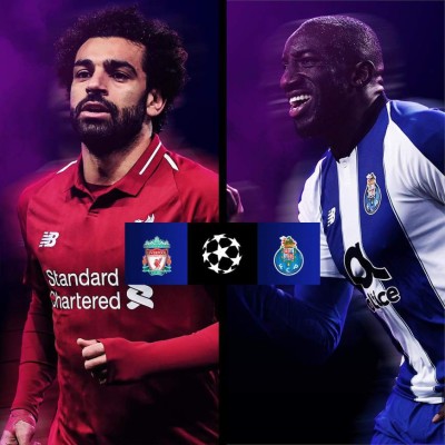 Liverpool's Guinean midfielder Naby Keita (R) celebrates with Liverpool's Brazilian midfielder Roberto Firmino after scoring a goal during the UEFA Champions League quarter-final, first leg football match between Liverpool and FC Porto at Anfield stadium in Liverpool, north-west England on April 9, 2019. (Photo by LLUIS GENE / AFP)