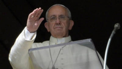 Pope Francis leads the Angelus prayer from the window of his apartments at St Peter's square on October 6, 2013 at the Vatican. AFP PHOTO / ANDREAS SOLARO