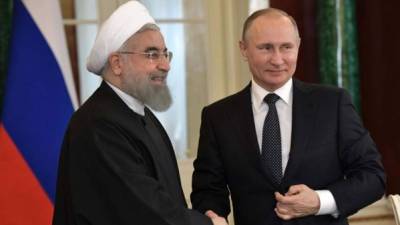 Hasan Rohaní, presidente de Irán junto a Vladímir Putin, presidente de Rusia.