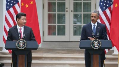 El mandatario chino Xi Jinping junto al presidente estadounidense Barack Obama.