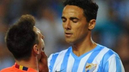 Weligton y Messi protagonizaron la imagen del partido entre el Málaga y el Barcelona.