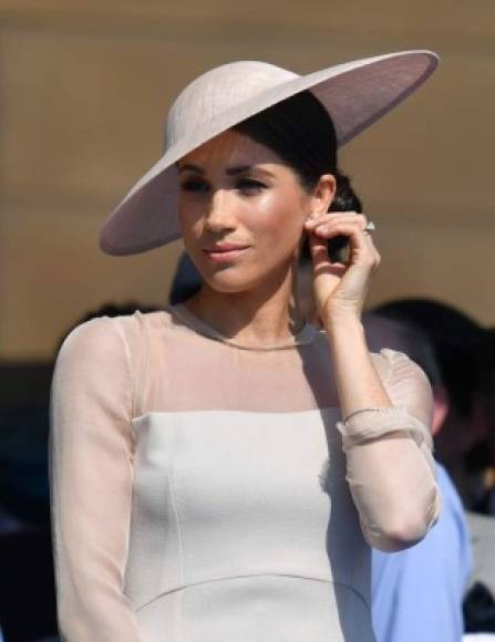 Britain's Meghan, Duchess of Sussex, attends the Prince of Wales's 70th Birthday Garden Party at Buckingham Palace in London on May 22, 2018.<br/>The Prince of Wales and The Duchess of Cornwall hosted a Garden Party to celebrate the work of The Prince's Charities in the year of Prince Charles's 70th Birthday. / AFP PHOTO / POOL / Dominic Lipinski