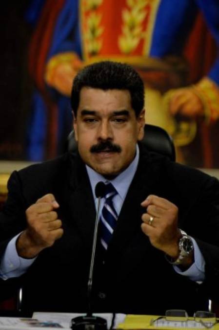 Venezuelan President Nicolas Maduro speaks during a press conference at the Miraflores presidential palace in Caracas on May 17, 2016.<br/>The army in crisis-hit Venezuela has to choose whether it is 'with the constitution or with (President Nicolas) Maduro,' opposition leader Henrique Capriles said Tuesday. / AFP PHOTO / FEDERICO PARRA