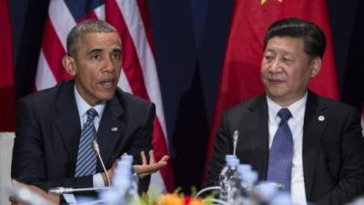 El expresidente Barack Obama y el presidente chino Xi Jinping.