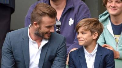 Cruz junto a su padre el famoso exfutbolista David Beckham.