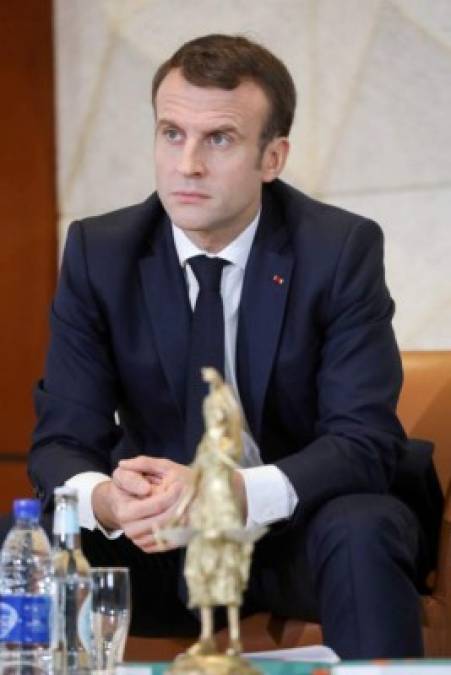 France's President Emmanuel Macron looks on during a meeting with 400 Chad women at the Women Palace in N'Djamena on December 23, 2018 as part of a visit to meet with 'Barkhane' soldiers and the Chadian President. (Photo by Ludovic MARIN / AFP)