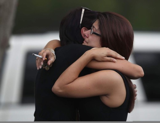 ORLANDO, FL - JUNE 15: Mourners hug as they arrive for the wake of Javier Jorge-Reyes at Family Funeral Care on June 15, 2016 in Orlando, Florida. Javier Jorge-Reyes died in the attack at the Pulse gay nightclub where Omar Mateen killed 49 people on June 12th in what is the deadliest mass shooting in the country's history. Joe Raedle/Getty Images/AFP== FOR NEWSPAPERS, INTERNET, TELCOS & TELEVISION USE ONLY ==