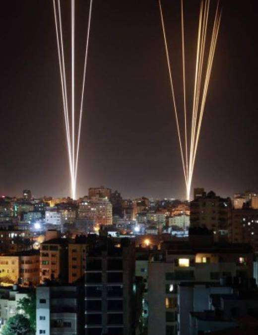 Rockets are launched from Gaza city, controlled by the Palestinian Hamas movement, in response to an Israeli air strike on a 12-storey building in the city, towards the coastal city of Tel Aviv, on May 11, 2021. (Photo by ANAS BABA / AFP)