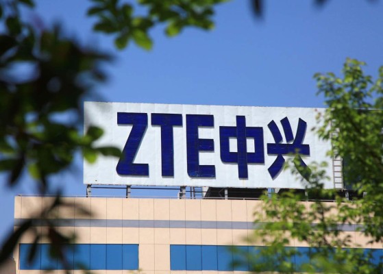 This photo taken on April 19, 2018 shows the ZTE logo on a building in Nanjing in China's eastern Jiangsu province.Chinese telecom giant ZTE vowed on April 20 to fight back against a US order banning it from purchasing and using US technology, a move that has angered Beijing. / AFP PHOTO / - / China OUT