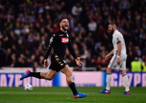 Napoli's midfielder Lorenzo Insigne celebrates a goal during the UEFA Champions League round of 16 first leg football match Real Madrid CF vs SSC Napoli at the Santiago Bernabeu stadium in Madrid on February 15, 2017. / AFP PHOTO / PIERRE-PHILIPPE MARCOU