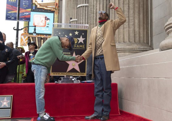 Rappers Pharrell Williams (L) and Snoop Dogg attend the ceremony honoring Snoop Dogg with a Star on Hollywood Walk of Fame, in Hollywood, California on November 19, 2018. (Photo by VALERIE MACON / AFP)