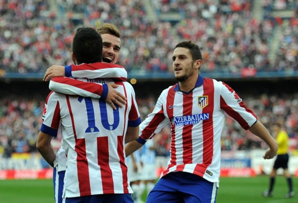 El Atlético supera al Málaga en un aguerrido partido