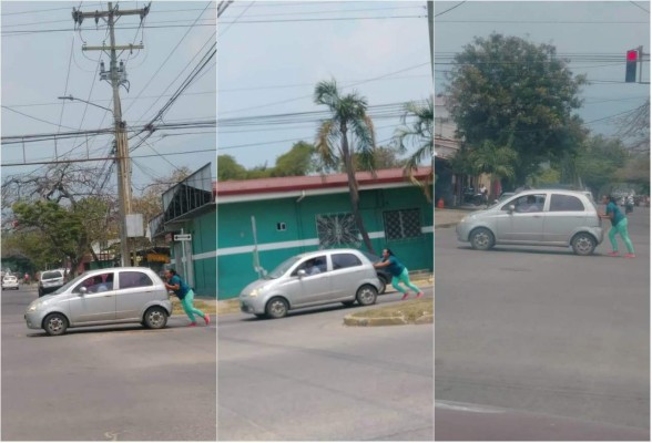 Mujer sorprende al empujar un vehículo en San Pedro Sula