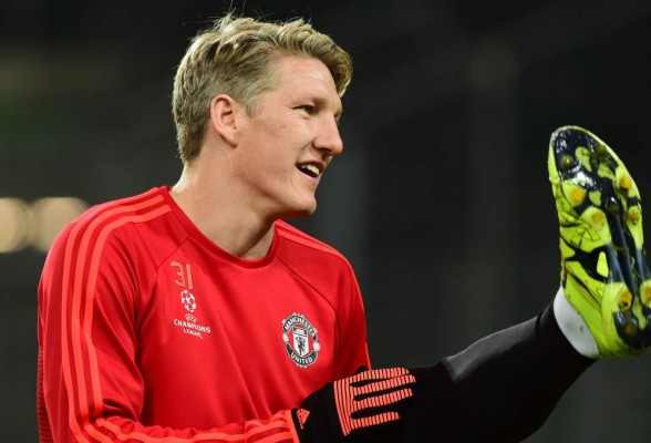 (FILES) This file photo taken on December 07, 2015 shows Manchester United's German midfielder Bastian Schweinsteiger warming up during a training session in Wolfsburg, central Germany, on December 7, 2015, one the eve of the UEFA Champions League Group B second-leg football match VfL Wolfsburg vs Manchester United. Former Germany captain Bastian Schweinsteiger has signed for Major League Soccer side the Chicago Fire from Premier League giants Manchester United, the English club confirmed on March 21, 2017 / AFP PHOTO / John MACDOUGALL