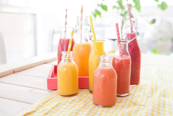 Variety of fresh smoothies in rainbow colors