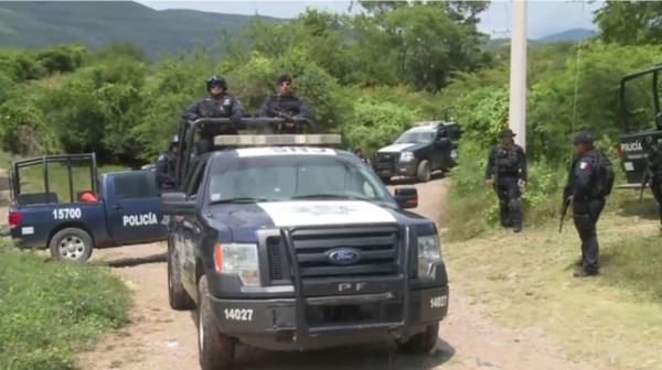 La identificación de los cuerpos hallados en la ciudad de Iguala (sur) puede demorarse días o semanas debido a su alto estado de carbonización. Foto AFP