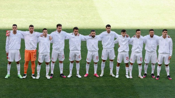 Spain's players line upe before the UEFA EURO 2020 Group E football match between Slovakia and Spain at La Cartuja Stadium in Seville on June 23, 2021. (Photo by POOL / AFP)