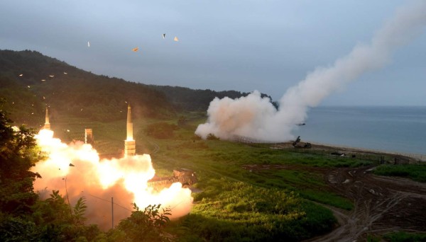 This handout photo taken on July 29, 2017 and provided by South Korean Defence Ministry in Seoul shows South Korea's Hyunmu-2 Missile System (L) and US Army Tactical Missile System (ATACMS) (R) firing missiles into the East Sea from an undisclosed location on South Korea's east coast during a South Korea-US joint missile drill aimed to counter North Koreas ICBM test.North Korean leader Kim Jong-Un said Pyongyang's latest test of an intercontinental ballistic missile confirmed all the US mainland was within striking range, state media reported on July 29. / AFP PHOTO / str / RESTRICTED TO EDITORIAL USE - MANDATORY CREDIT 'AFP PHOTO / SOUTH KOREAN DEFENCE MINISTRY' - NO MARKETING NO ADVERTISING CAMPAIGNS - DISTRIBUTED AS A SERVICE TO CLIENTS