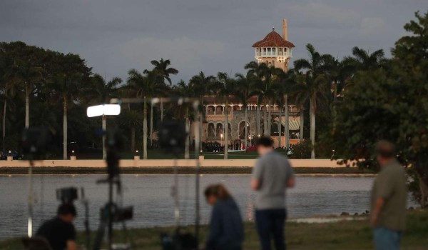 WEST PALM BEACH, FL - FEBRUARY 11: A television news crew is seen in front of the Mar-a-Lago Resort where President Donald Trump is hosting Japanese Prime Minister Shinzo Abe on February 11, 2017 in West Palm Beach, Florida. The two are scheduled to get in a game of golf as well as discuss trade issues. Joe Raedle/Getty Images/AFP