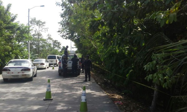 Policía cierra calle en busca de varios cadáveres en La Ceiba