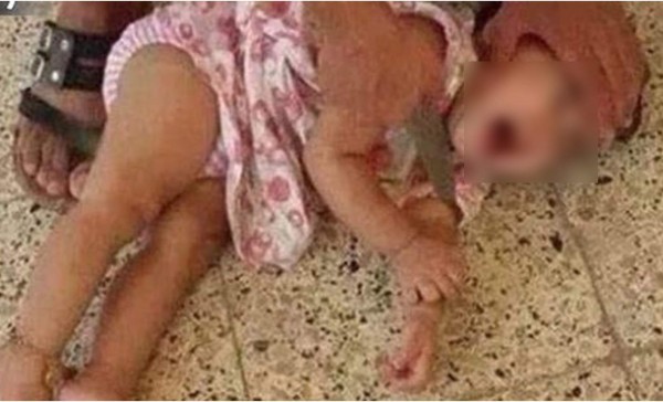 Horror: Divulgan foto de bebé a punto de ser decapitada por Isis