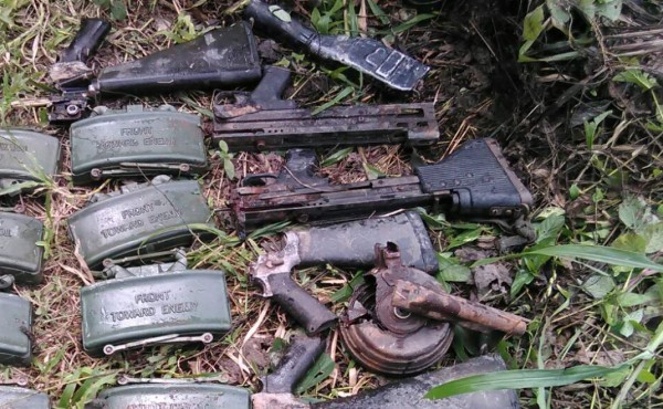 Hallan armas militares enterradas cerca del río Aguán en Colón