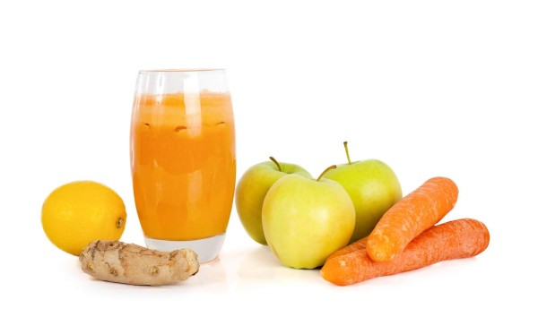 Freshly made super fruit and vegetable juice made with apples, carrots, lemon and ginger
