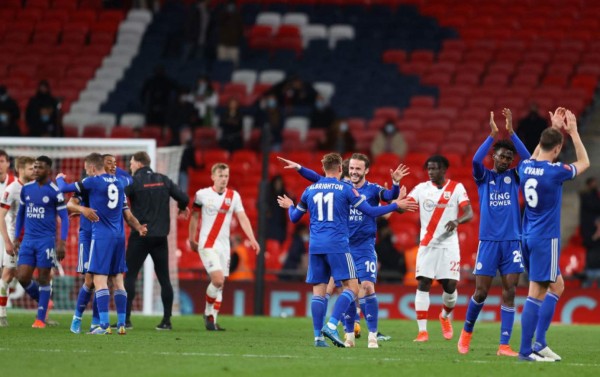 Leicester City's players celebrate their win on the final whistle in the English FA Cup semi-final football match between Leicester City and Southampton at Wembley Stadium in north west London on April 18, 2021. - Leicester won the game 1-0. (Photo by Richard Heathcote / POOL / AFP) / NOT FOR MARKETING OR ADVERTISING USE / RESTRICTED TO EDITORIAL USE