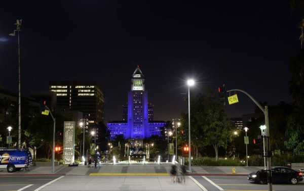 LOS ANGELES, CA - APRIL 21: Los Angeles City Hall is lit up in purple in memory of musician Prince on April 21, 2016, in Los Angeles, California. Prince, who was 57, died at his estate in Minneapolis, Minnesota. Kevork Djansezian/Getty Images/AFP== FOR NEWSPAPERS, INTERNET, TELCOS & TELEVISION USE ONLY ==