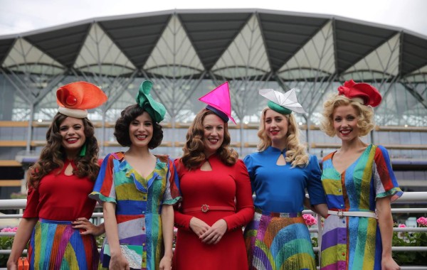 Members of The Tootsie Rollers jazz band pose for a photograph as they arrive on day one of the Royal Ascot horse racing meet, in Ascot, west of London, on June 19, 2018. The five-day meeting is one of the highlights of the horse racing calendar. Horse racing has been held at the famous Berkshire course since 1711 and tradition is a hallmark of the meeting. Top hats and tails remain compulsory in parts of the course while a daily procession of horse-drawn carriages brings the Queen to the course. / AFP PHOTO / Daniel LEAL-OLIVAS