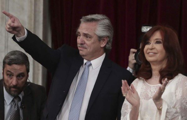 Argentina's incoming president Alberto Fernandez (L) gestures next to his vice-president, former president (2007-2015) Cristina Fernandez de Kirchner, during his inauguration ceremony at the Congress in Buenos Aires on December 10, 2019. (Photo by Alejandro PAGNI / AFP)