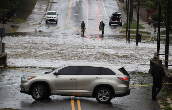 FAYETTEVILLE, NC - SEPTEMBER 16: A vehicle turns around at Cross Creek that has been turned into a river by the rains from Hurricane Florence as it passed through the area on September 16, 2018 in Fayetteville, North Carolina. Rain continues to inundate the region causing concern for large scale flooding after Hurricane Florence hit the North Carolina and South Carolina area. Joe Raedle/Getty Images/AFP
