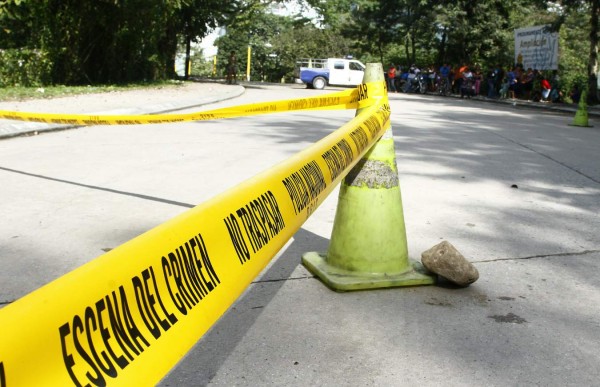 Pistoleros matan a dos amigos en Puerto Cortés