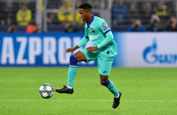 Barcelona´s Guinea-Bissau forward Ansu Fati plays the ball during the UEFA Champions League Group F football match Borussia Dortmund v FC Barcelona in Dortmund, western Germany, on September 17, 2019. (Photo by John MACDOUGALL / AFP)