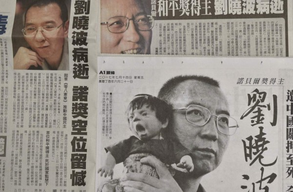 This photo illustration shows a collection of Taiwanese newspapers in Taipei on July 14, 2017 reporting on the death of China's Nobel laureate Liu Xiaobo.Liu died on July 13 after a battle with cancer, remaining in custody until the end as officials rebuffed international pleas to let the prominent dissident receive treatment abroad. / AFP PHOTO / SAM YEH
