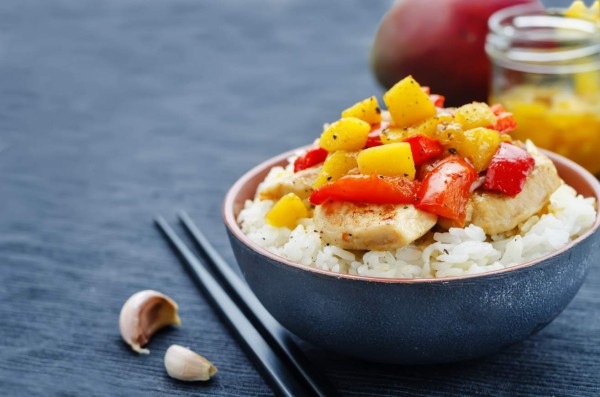 mango chicken stir fry with rice. the toning. selective focus