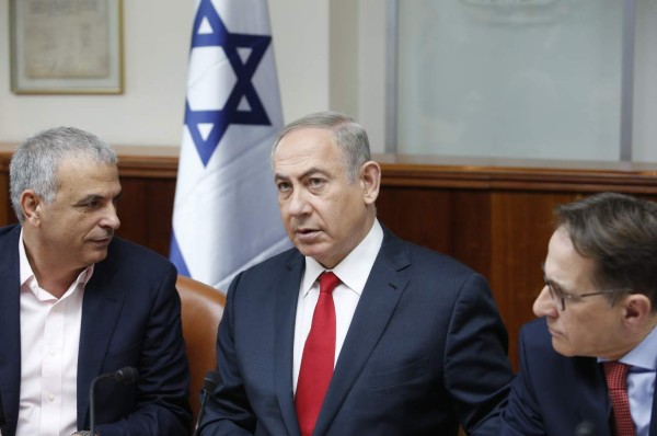 (FILES) In this file photo taken on December 22, 2020 Israeli Prime Minister Benjamin Netanyahu leaves after a speech at the Knesset (Israeli Parliament) in Jerusalem. - Israel's opposition leader Yair Lapid said late on June 2, 2021 that he had succeeded in forming a coalition to end the rule of Prime Minister Benjamin Netanyahu, the country's longest serving leader.Lapid's announcement came in the final hour before a midnight deadline, after he had hammered out deals with a diverse group of ideological rivals who banded together to oust the right-wing premier. (Photo by YONATAN SINDEL / POOL / AFP)