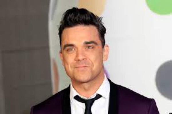 Robbie Williams se burla de Bruce Jenner