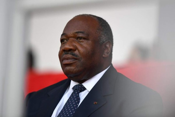 (FILES) In this file photo taken on February 5, 2017 Gabonese President Ali Bongo Ondimba attends the closing ceremony of the 2017 Africa Cup of Nations football tournament at the Stade de l'Amitie Sino-Gabonaise in Libreville. - Gabon soldiers on state radio early January 7, 2019 called on the people to 'rise up' and announced a 'national restoration council' would be formed, as an ailing President is out of the country. Shots were heard in the around state television headquarters in the centre of the capital at about the same time as the message was read at 6:30 am. (Photo by GABRIEL BOUYS / AFP)