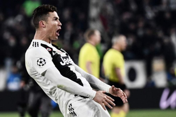 Juventus' Portuguese forward Cristiano Ronaldo celebrates after scoring 3-0 during the UEFA Champions League round of 16 second-leg football match Juventus vs Atletico Madrid on March 12, 2019 at the Juventus stadium in Turin. (Photo by Marco BERTORELLO / AFP)