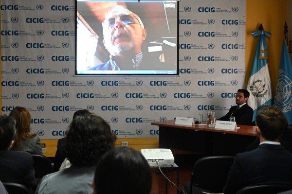The head of the International Commission Against Impunity in Guatemala (CICIG), Colombian Ivan Velasquez, is seen on a screen during the presentation of a report entitled 'Guatemala, a Captured State', in Guatemala City on August 28,2019. - The Cicig's mandate comes to an end next Tuesday after President Jimmy Morales broke his promise to extend its mandate for two more years. (Photo by Johan ORDONEZ / AFP)