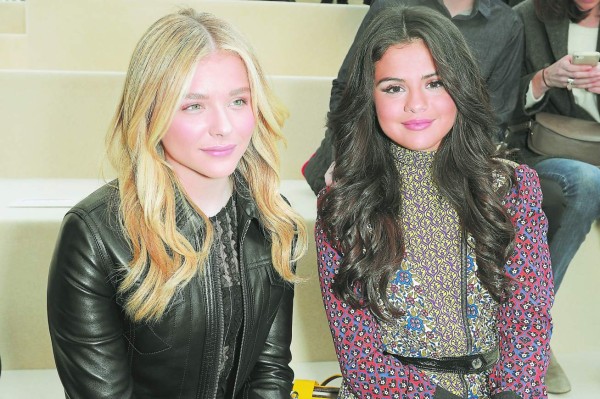 PARIS, FRANCE - MARCH 11: (L-R) Chloe Grace Moretz and Selena Gomez attend the Louis Vuitton show as part of the Paris Fashion Week Womenswear Fall/Winter 2015/2016 on March 11, 2015 in Paris, France. (Photo by Dominique Charriau/WireImage)