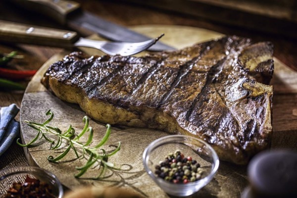 T-Bone Steak freshly roasted on Barbecue Grill