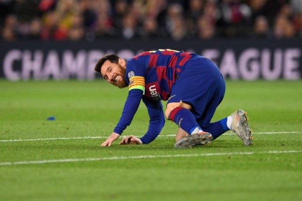 Barcelona's Argentine forward Lionel Messi reacts on the ground during the UEFA Champions League group F football match between FC Barcelona and SK Slavia Prague at the Camp Nou stadium in Barcelona on November 5, 2019. (Photo by Josep LAGO / AFP)