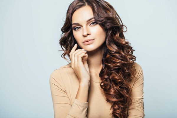 Studio shot of young beautiful woman. Professional make-up and hairstyle.