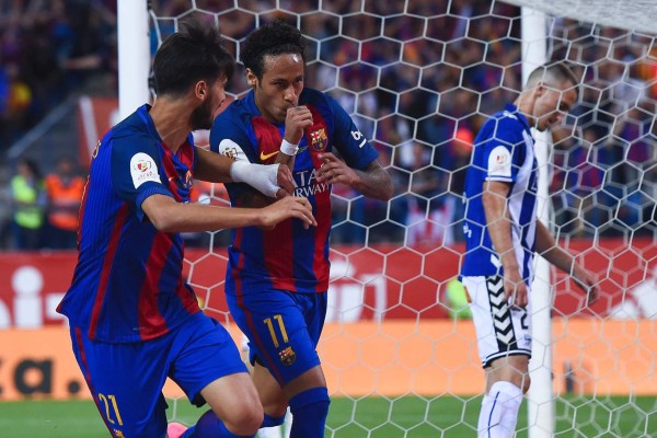 Barcelona's Brazilian forward Neymar (R) celebrates with Barcelona's Portuguese midfielder Andre Gomes after scoring during the Spanish Copa del Rey (King's Cup) final football match FC Barcelona vs Deportivo Alaves at the Vicente Calderon stadium in Madrid on May 27, 2017. / AFP PHOTO / Josep LAGO