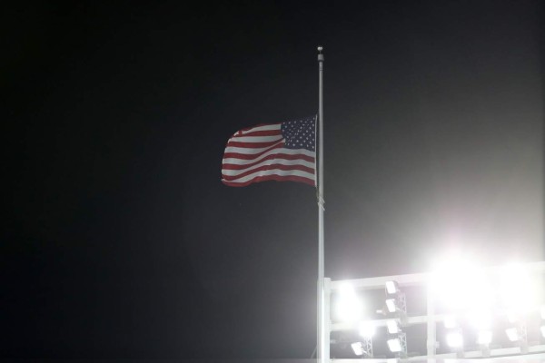 NEW YORK, NY - OCTOBER 03: The flag is flown at half-staff in wake of deadly Las Vegas shooting during the American League Wild Card Game between the Minnesota Twins and the New York Yankees at Yankee Stadium on October 3, 2017 in the Bronx borough of New York City. Elsa/Getty Images/AFP== FOR NEWSPAPERS, INTERNET, TELCOS & TELEVISION USE ONLY ==