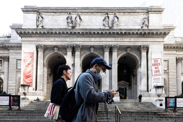NEW YORK, NY - MARCH 13: Pedestrians walk past New York Public library on March 13, 2020 in New York City. President Donald Trump is expected to declare national emergency over coronavirus crisis today. There are at least 95 confirmed cases in New York City. Jeenah Moon/Getty Images/AFP== FOR NEWSPAPERS, INTERNET, TELCOS & TELEVISION USE ONLY ==