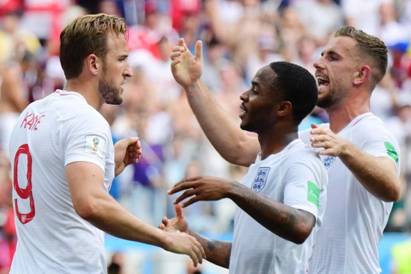 England's forward Harry Kane (L) celebrates with England's forward Raheem Sterling and England's midfielder Jordan Henderson (R) after scoring his team's fifth goal during the Russia 2018 World Cup Group G football match between England and Panama at the Nizhny Novgorod Stadium in Nizhny Novgorod on June 24, 2018. / AFP PHOTO / Martin BERNETTI / RESTRICTED TO EDITORIAL USE - NO MOBILE PUSH ALERTS/DOWNLOADS